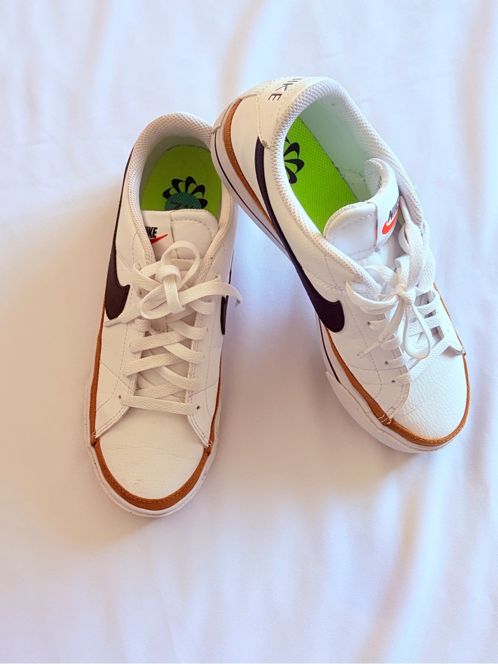 Nike White Sneakers with Brown Trim and Black Swoosh